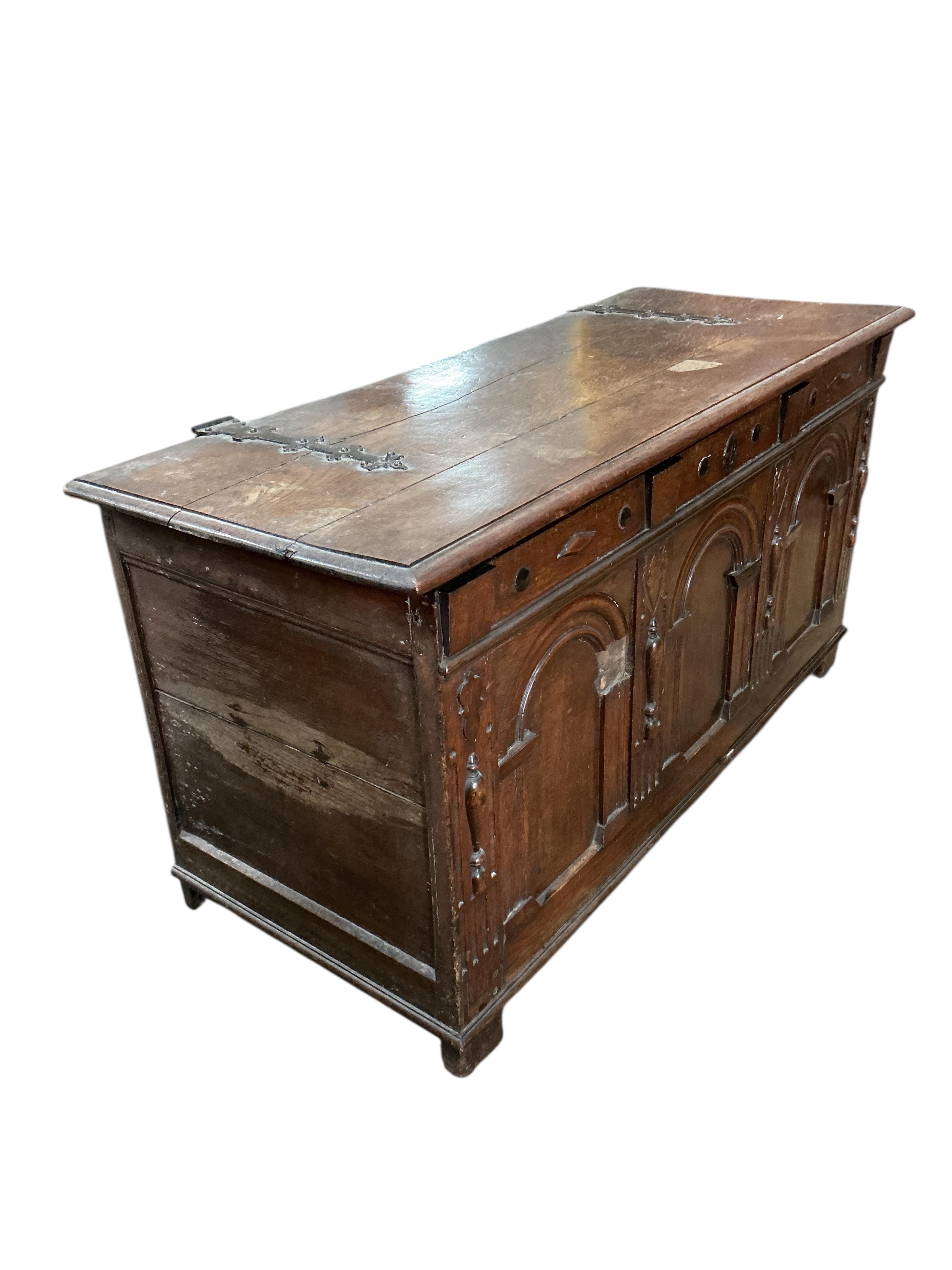 An 18th century oak coffer, width 129cm, depth 53cm, height 66cm